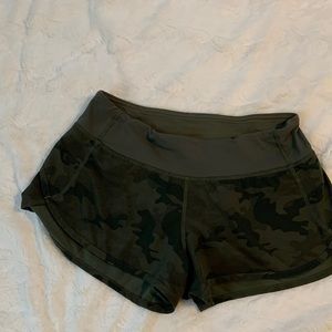 Womens Lululemon low rise running shorts. Green camo, size 4